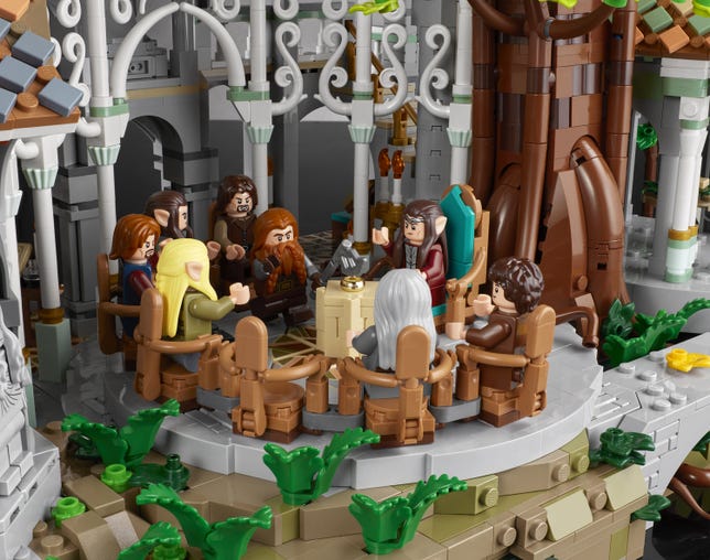 Close-up look at Lego Rivendell set component of the Council Ring with brown Lego chairs and minifigures sitting in them. Small green plants around them.