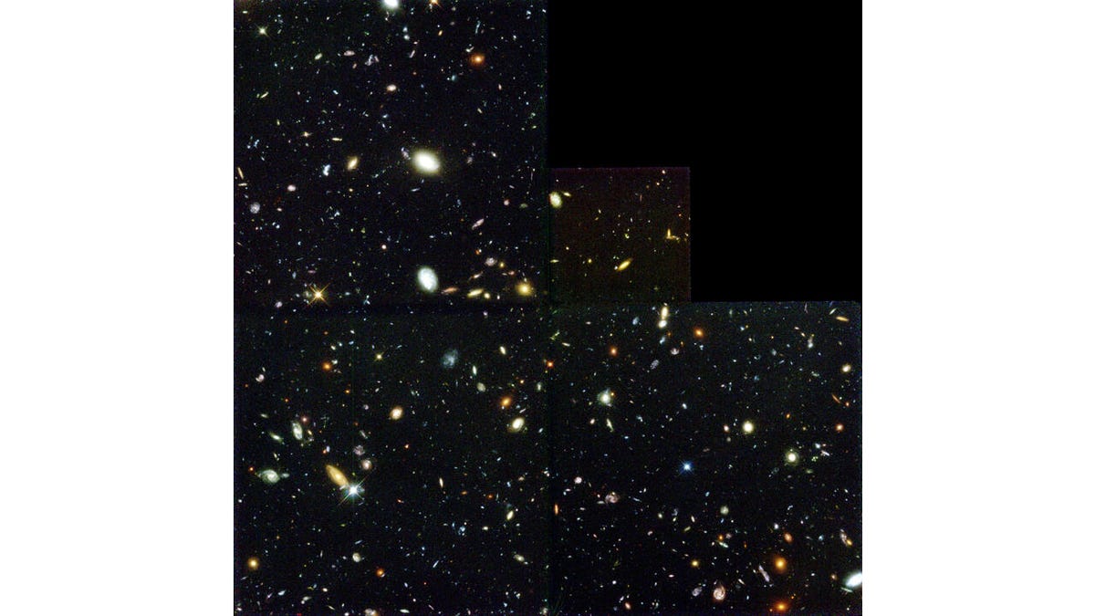 Against a dark background are galaxies and stars from the distant universe.