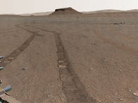 <p>It took hundreds of images to put together a broad Martian panorama showing all 10 of the Perseverance rover's sample depot tubes on the ground.</p>