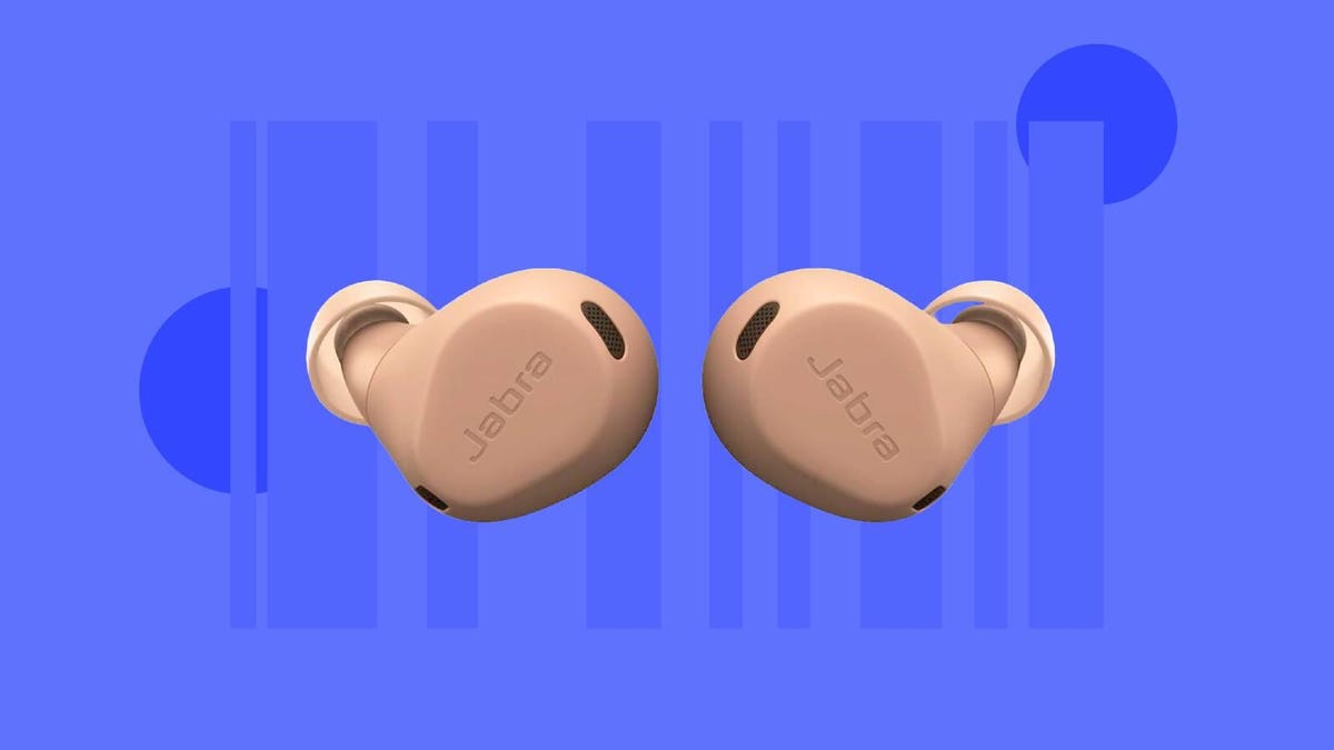 A pair of tan Jabra earbuds against a blue background.
