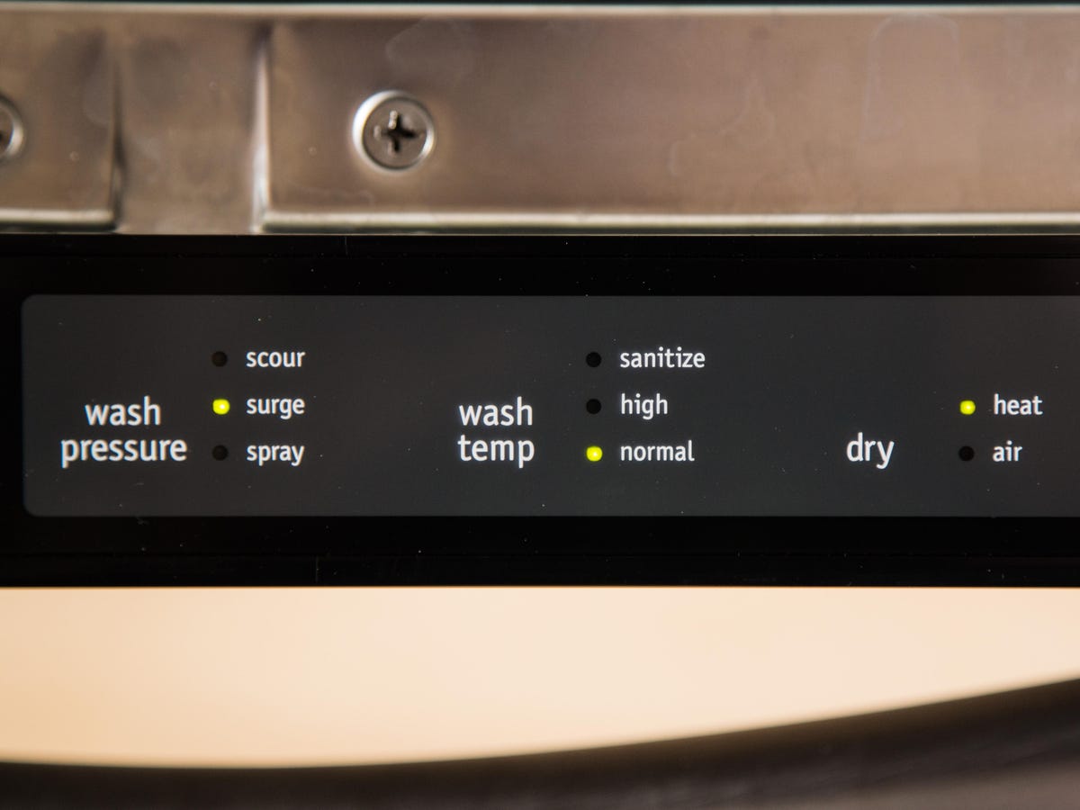 Close-up of standard dishwasher settings: Surge wash pressure, normal wash temp, and heated dry are set to on.