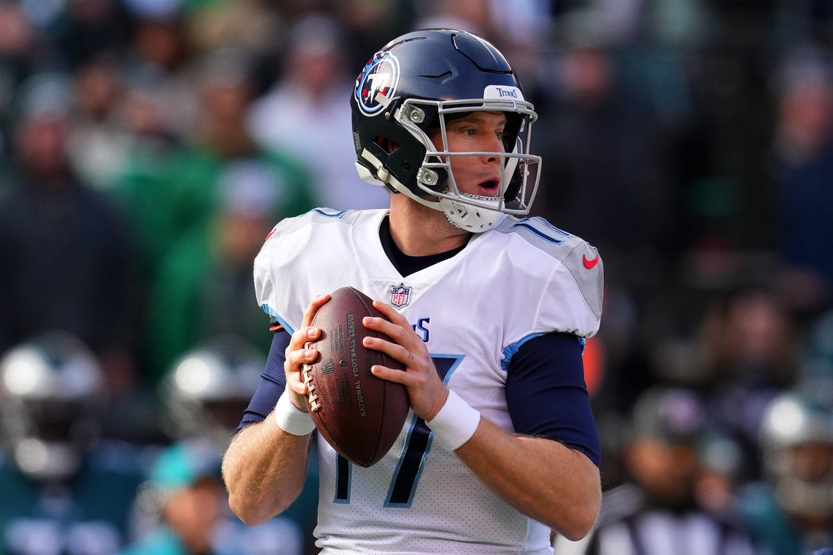 Ryan Tannehill of the Tennessee Titans winds up to pass a football.