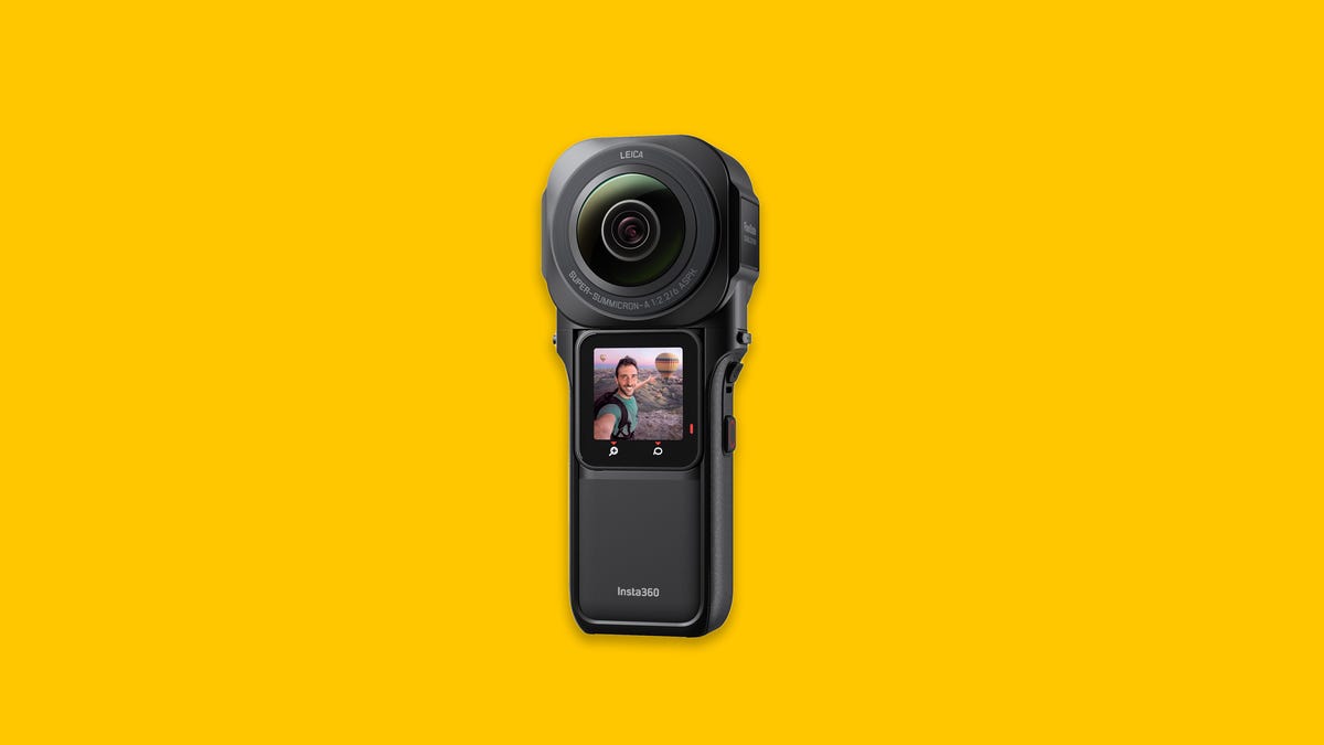 Insta360 One RS 1-inch 360 camera with display showing on yellow background.