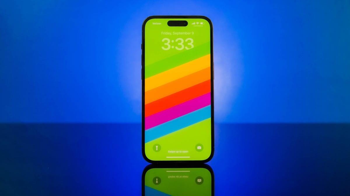 An iPhone 14 Pro against a blue background.