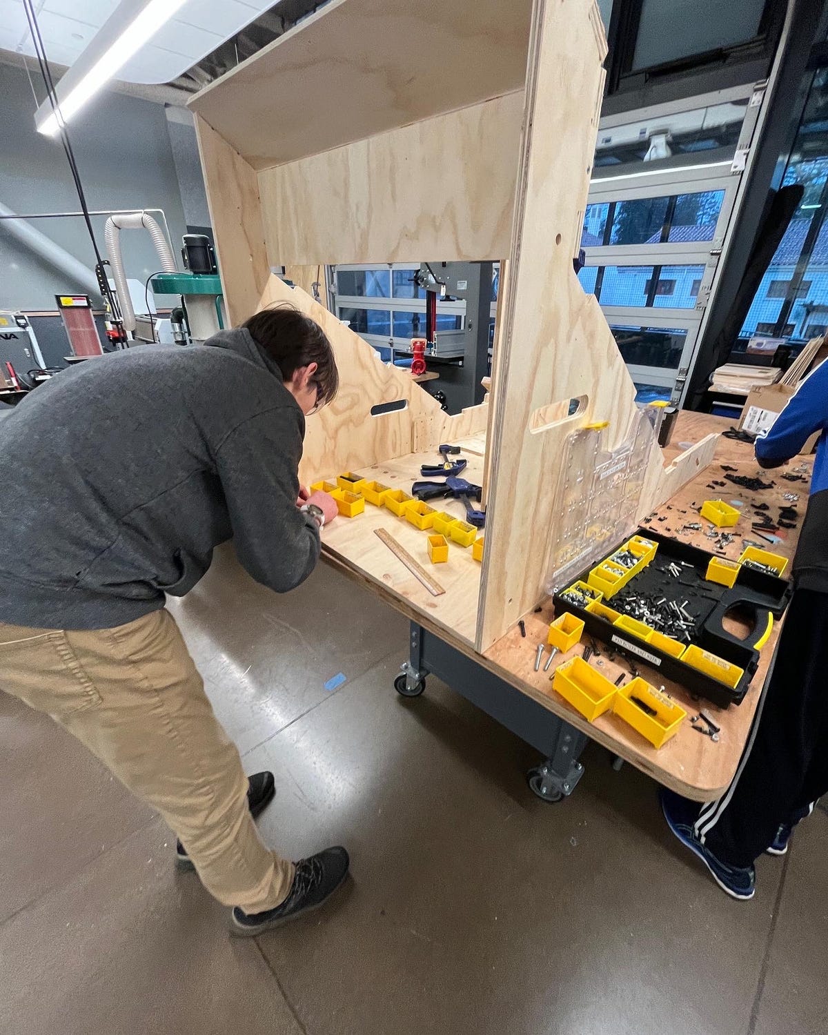 Here's FRC 8033 member Jake Baker constructing prototype field elements out of wood so the team can practice on a simulated competition field.