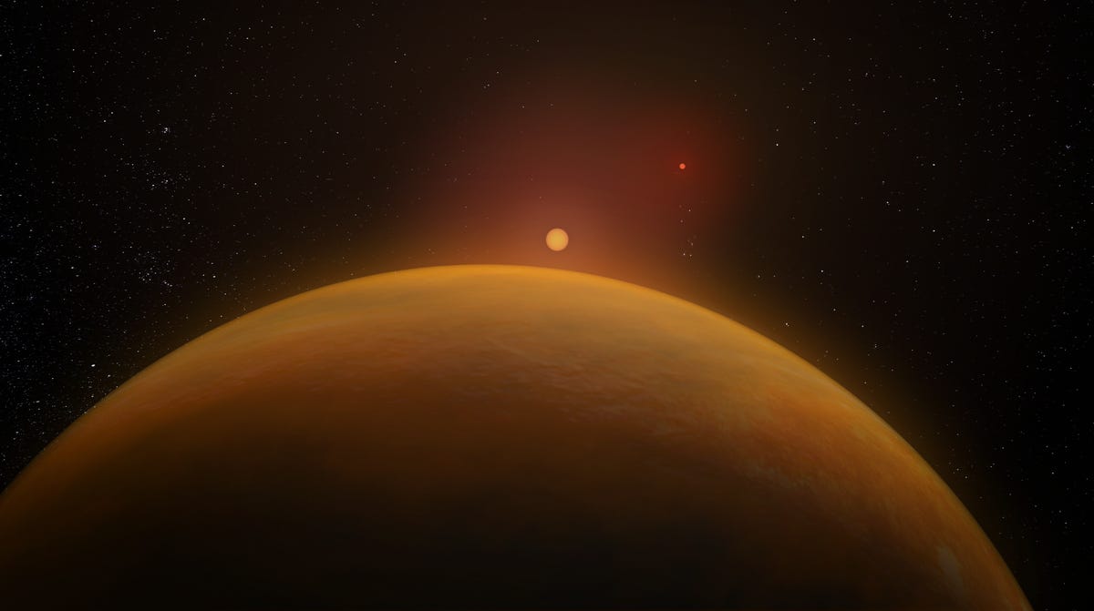 Peeking out from the bottom of the frame is a yellow-orange planet representing the exoplanet studied by the scientists. Above its horizon line, you can see a small yellow, glowing dot representing a star and far away from these two spheres lies a crimson red dot representing another star.