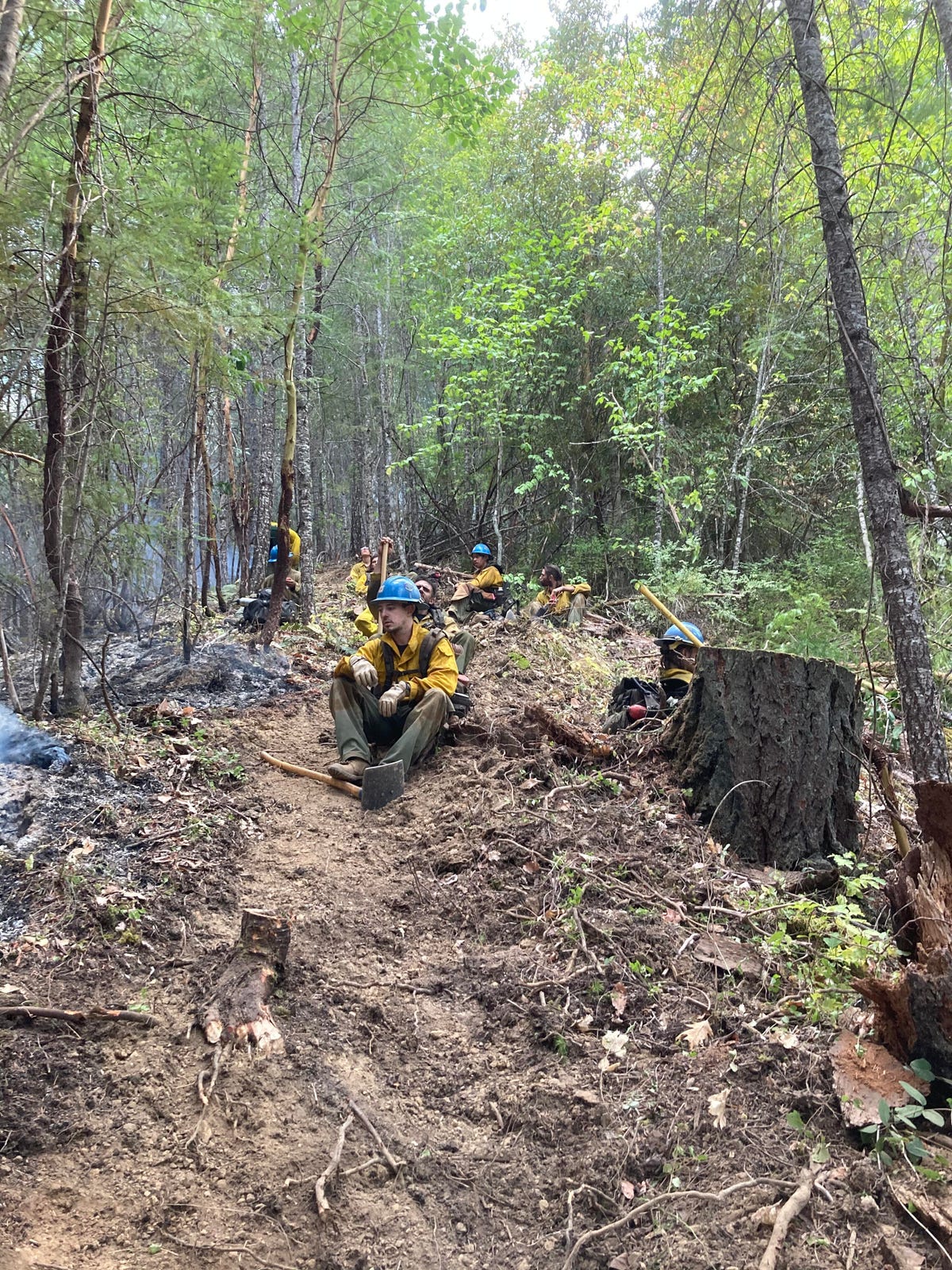 Carson Hotshots rest on a trail after fighting a wildfire