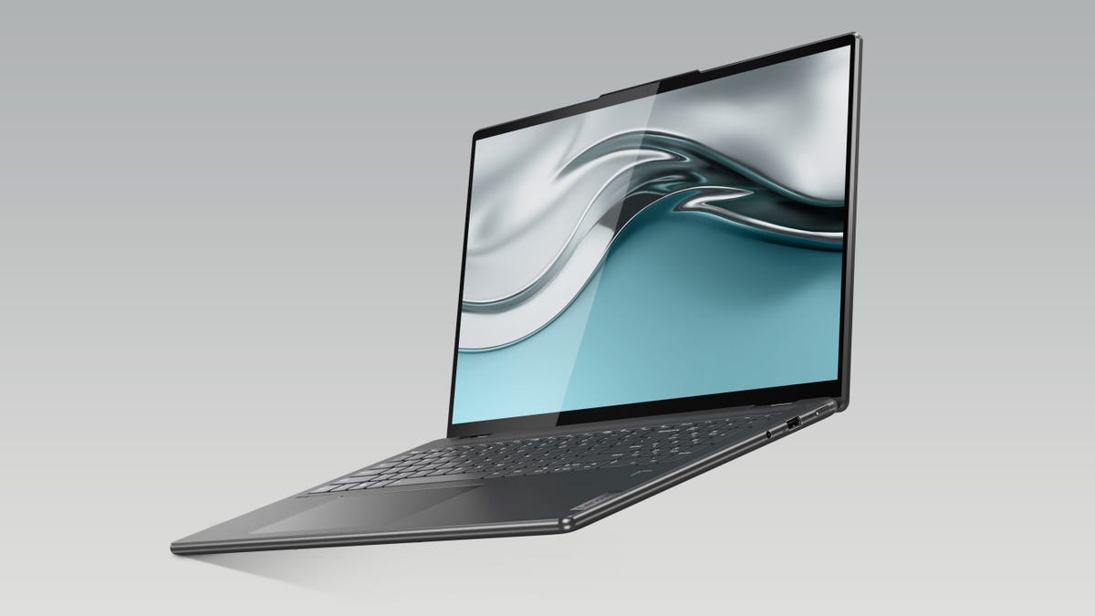 An open Lenovo laptop against a grey background.