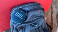 JBL Clip 4, clipped to a backpack