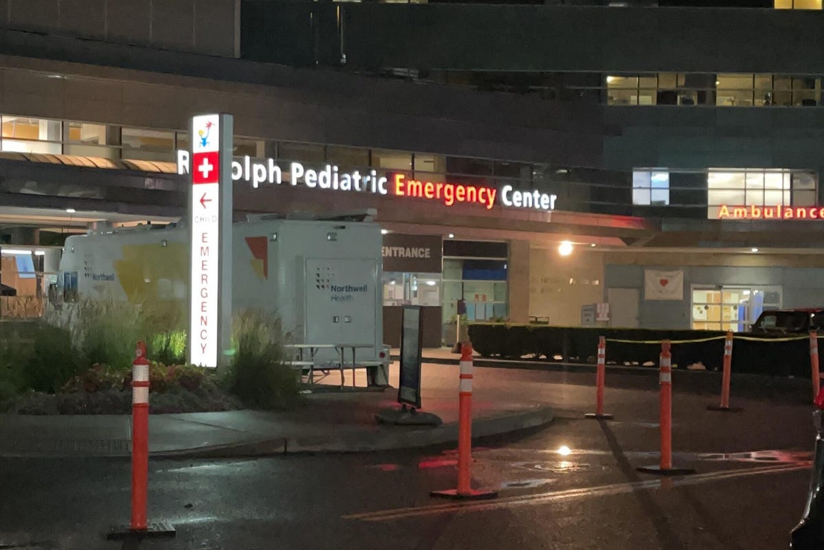 Outside a pediatric emergency center at night