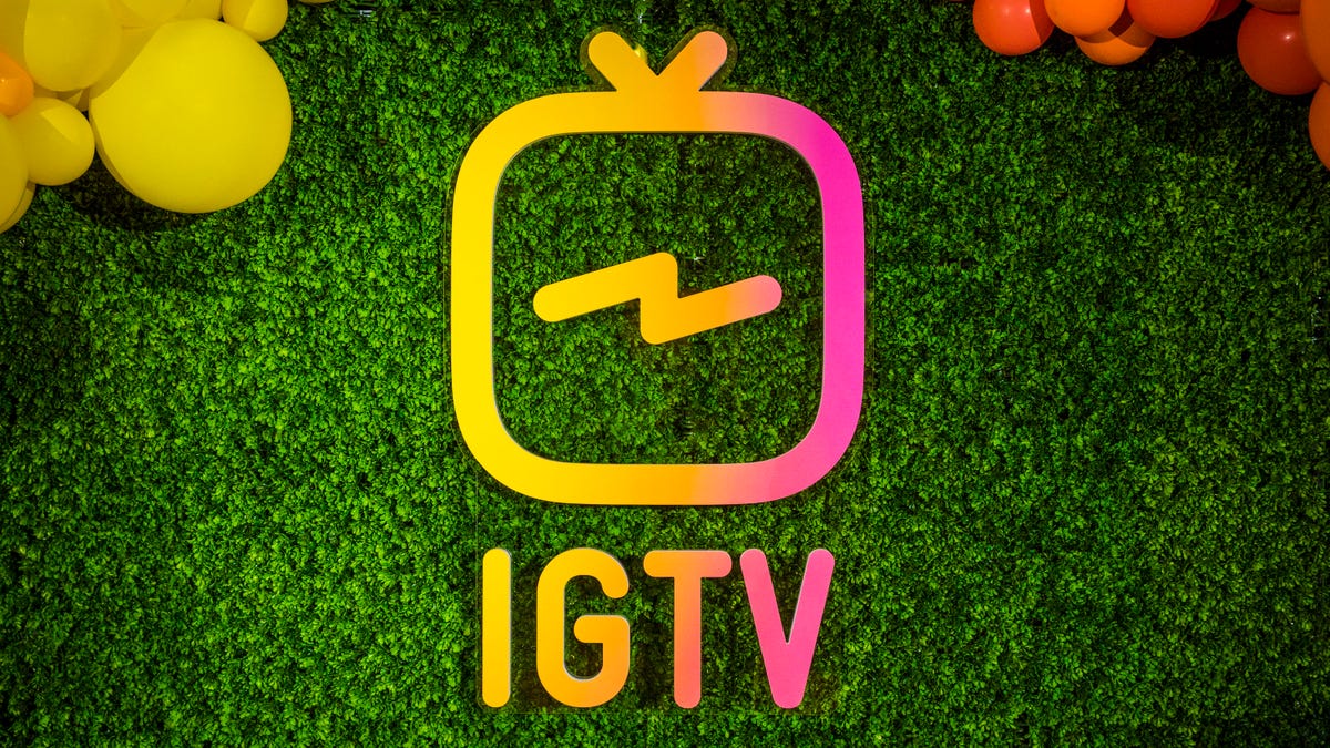 The IGTV logo on display on a wall of astroturf