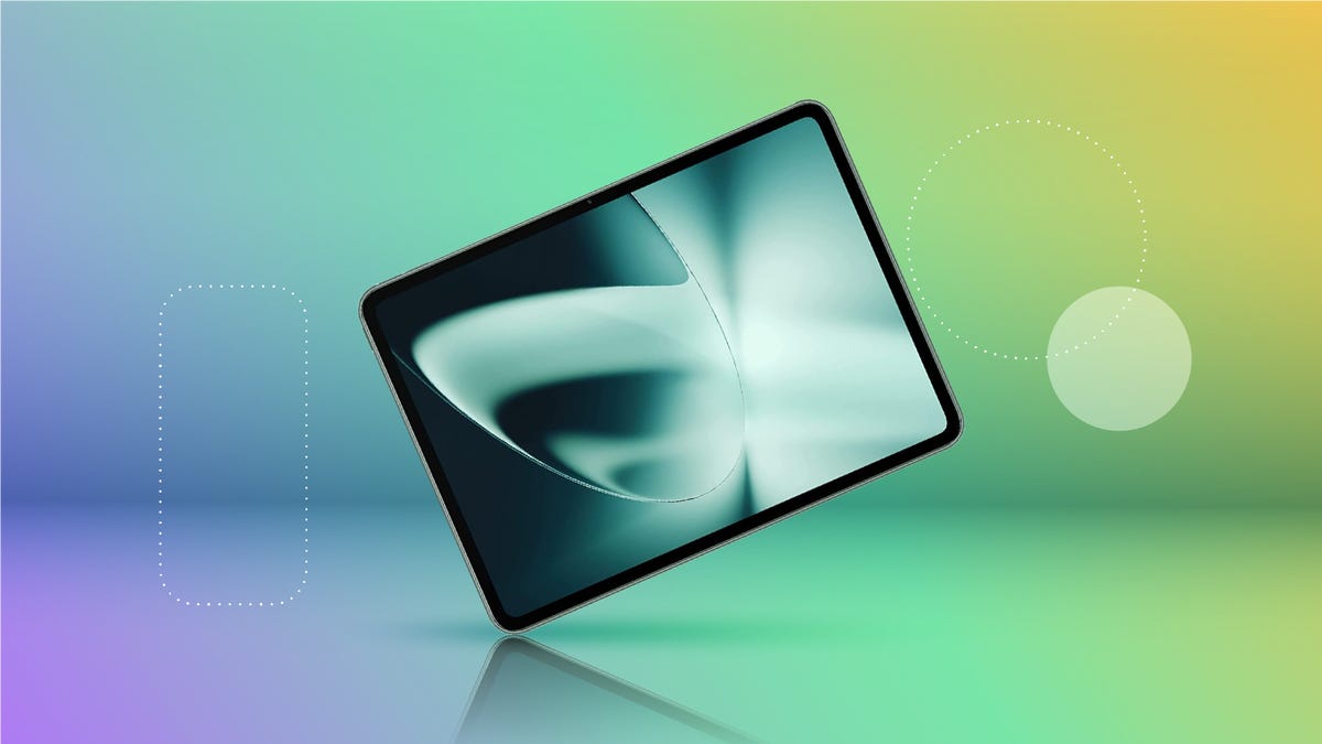 A OnePlus Pad tablet against a green background.