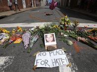 <p>Flowers surround a photo of 32-year-old Heather Heyer, who was killed when a car plowed into a crowd of people protesting against the white supremacist Unite the Right rally on Saturday in Charlottesville, Virginia.</p>