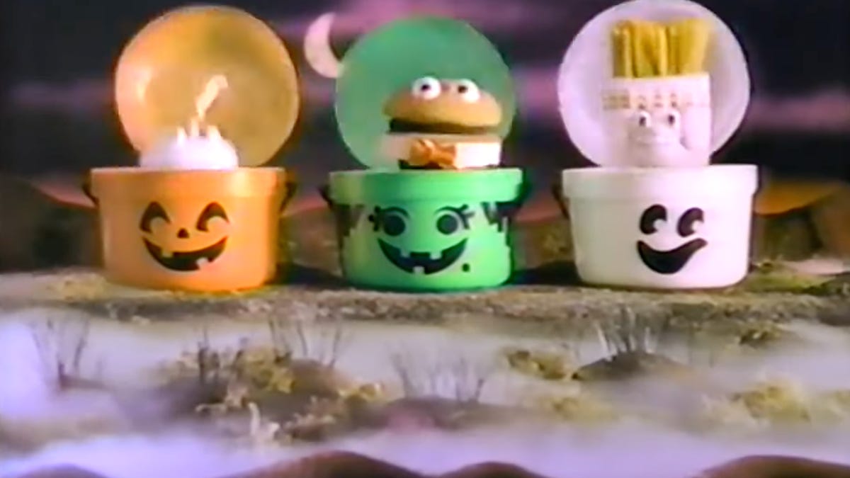 Three McDonald's Halloween pails: one orange, one green and one white