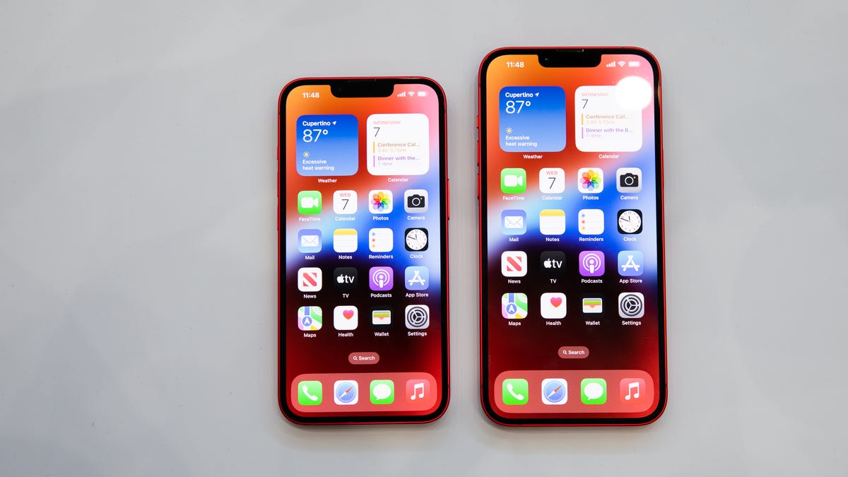 iPhone 14 and iPhone 14 Plus side by side on a gray background