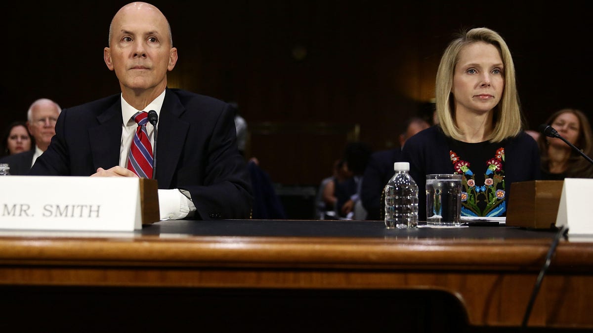 Former Equifax CEO Richard Smith, left, and former Yahoo CEO Marissa Mayer testify before Congress.