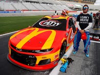 <p>Bubba Wallace, wearing an "I can't breathe" shirt next to his No. 43 Chevy in support of the Black Lives Matter movement.</p>