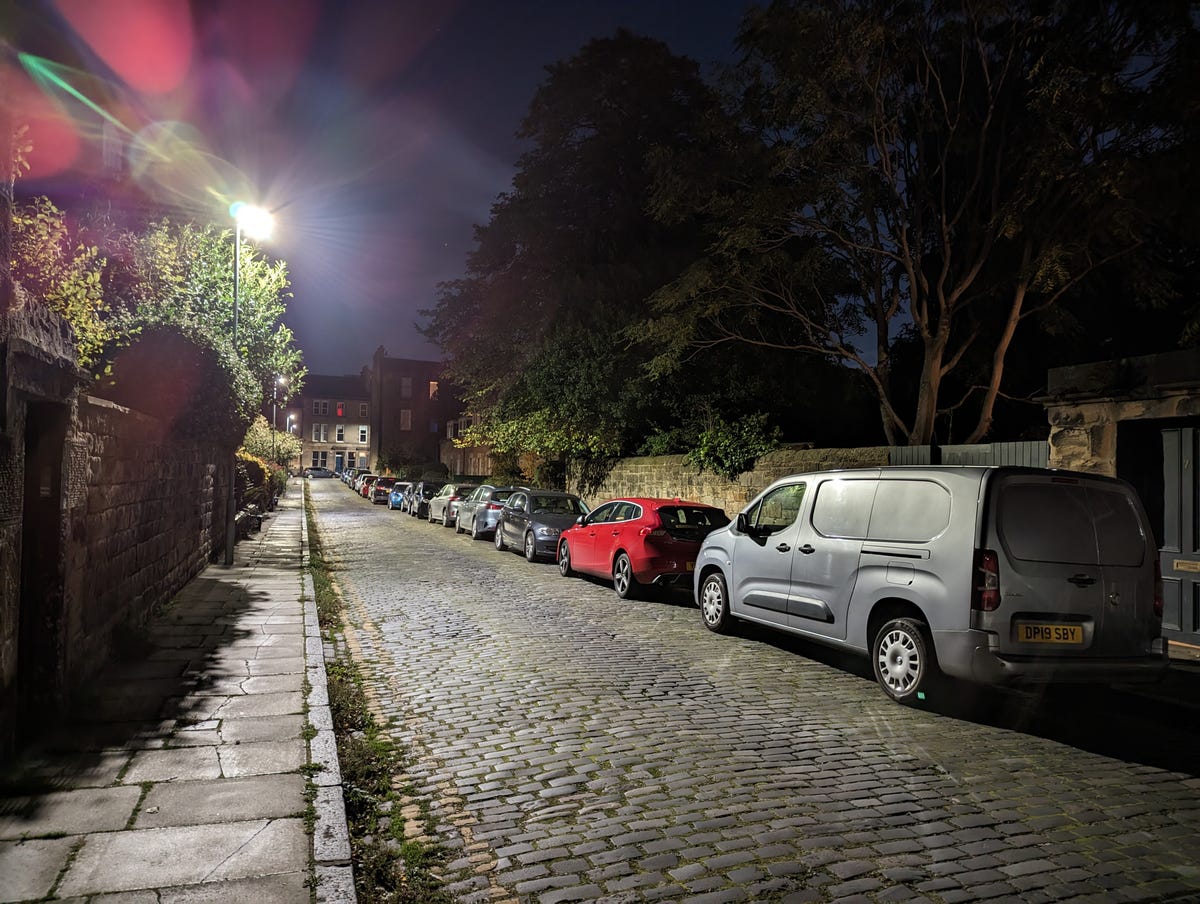 An image showing a night time street with lens flares from a street light.