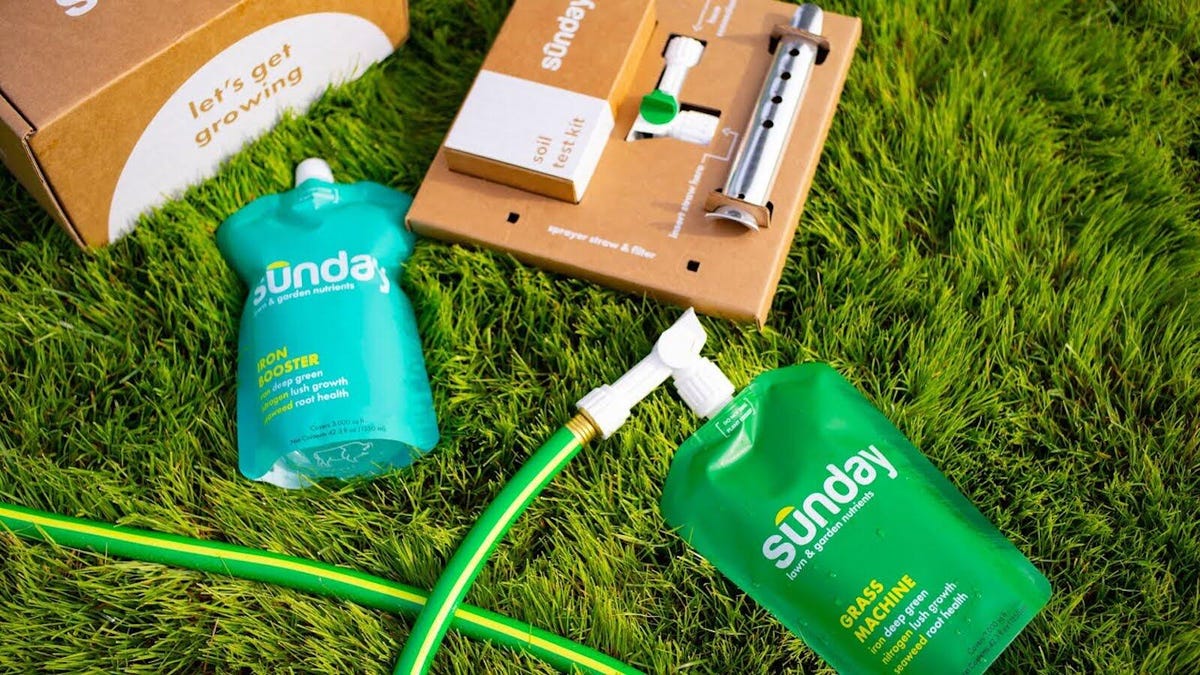 the sunday lawn care kit on a grassy background