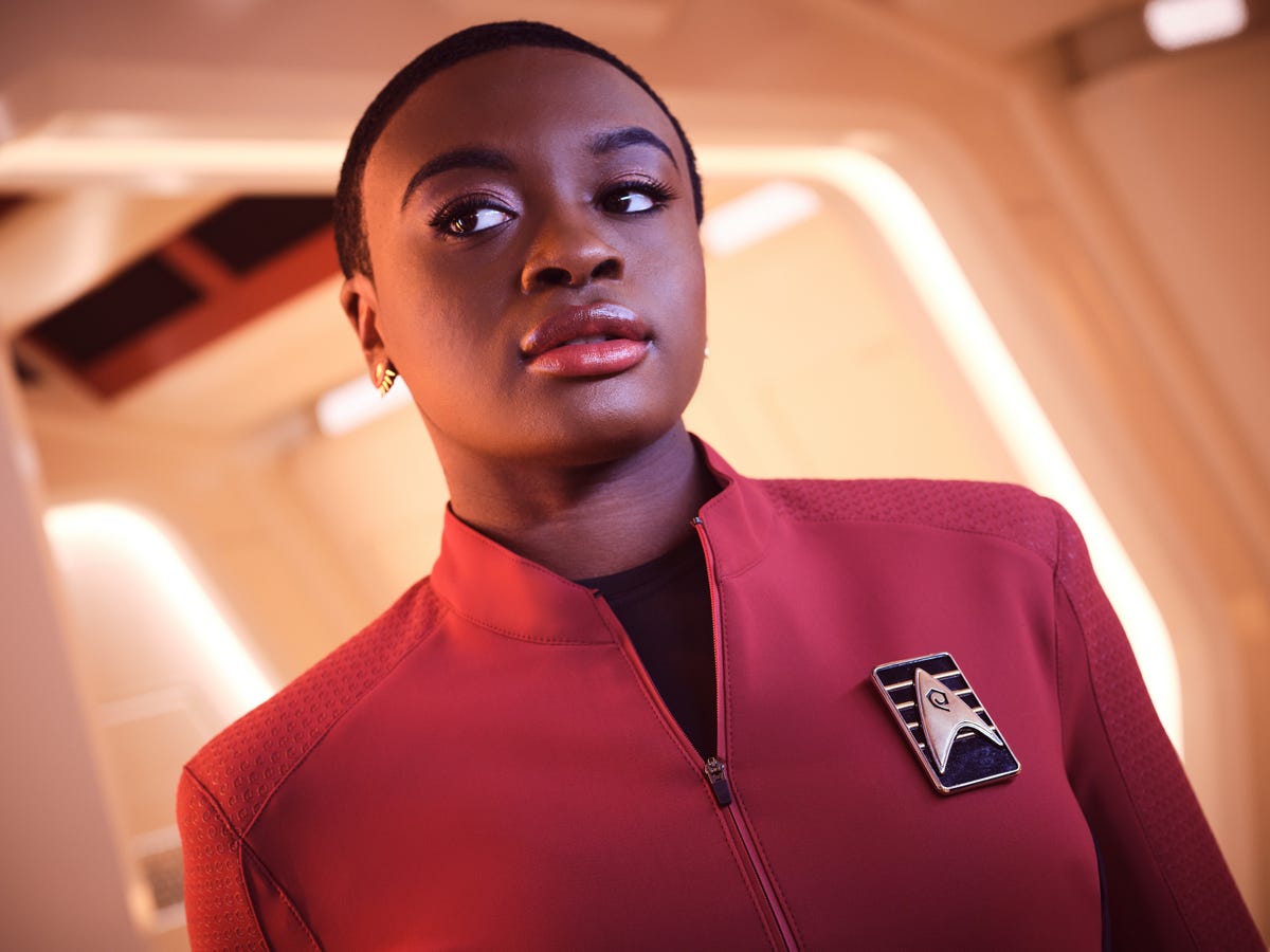 Celia Rose Gooding as young Uhura in a red Starfleet uniform in Star Trek: Strange New Worlds.