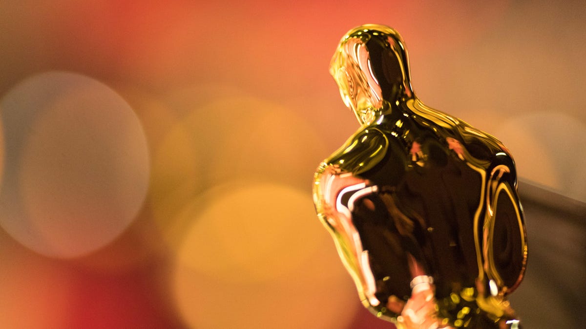 A closeup of an Oscar statuette from behind