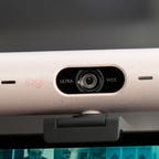 Logitech Brio 500 webcam mounted on a desktop display
