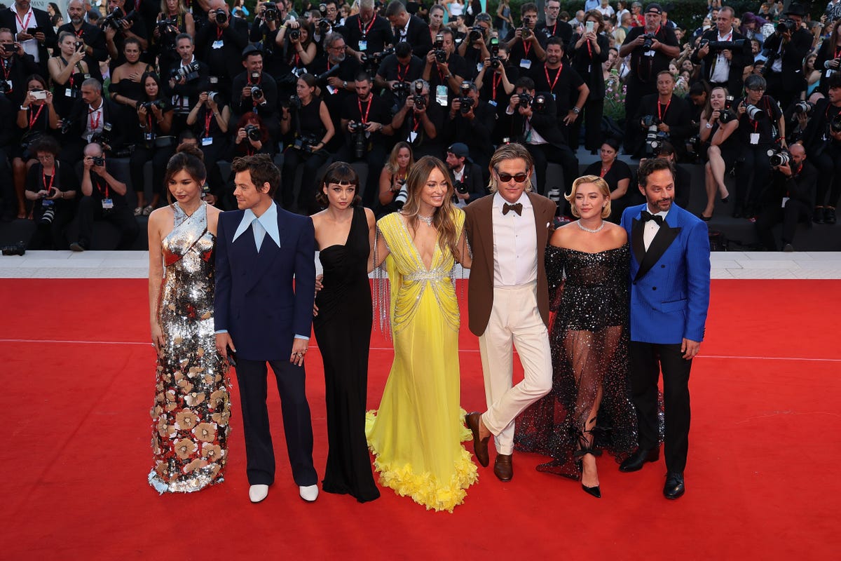 The cast of Don't Worry Darling in fancy dress on the red carpet