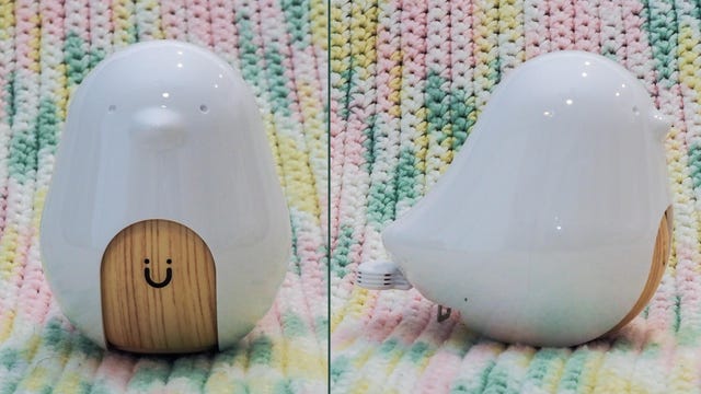 A chick-shaped baby monitor against a pastel blanket 