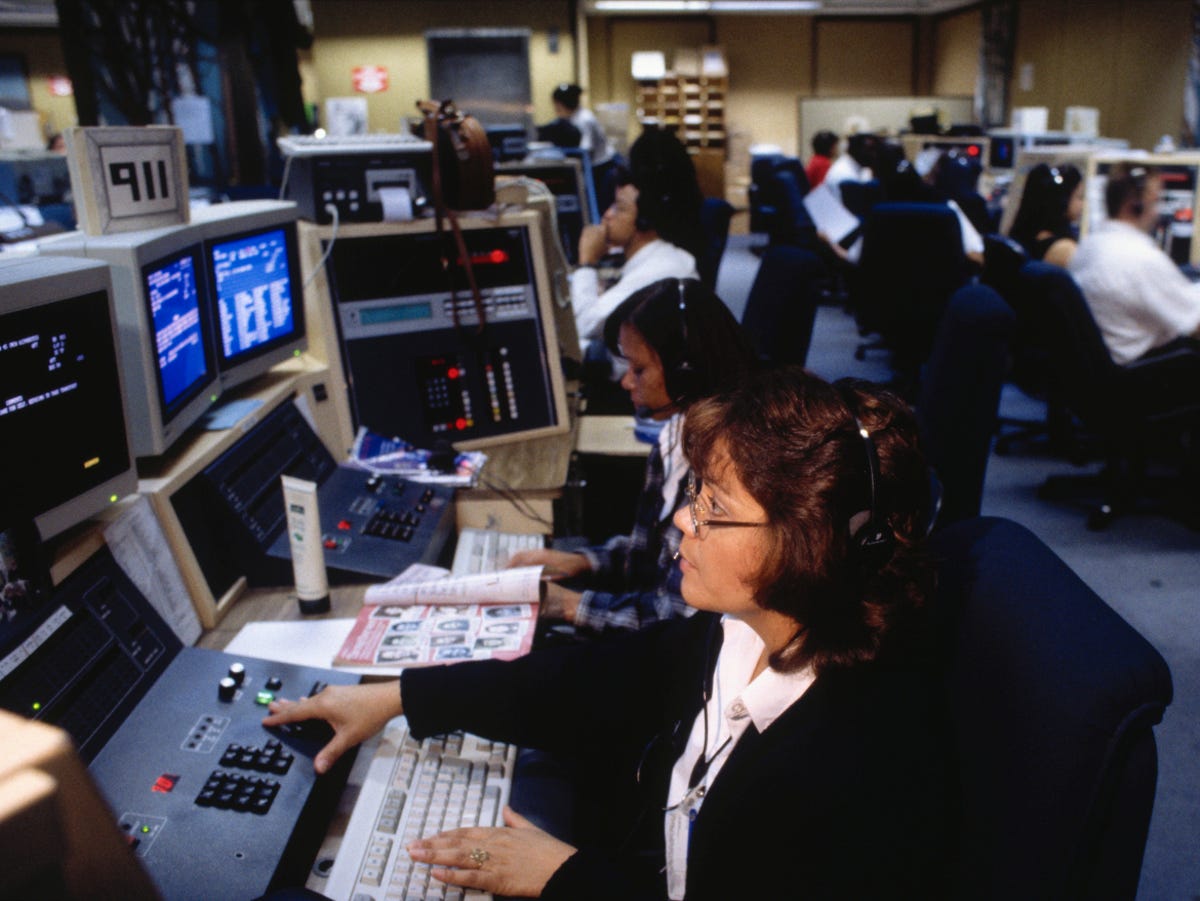Workers at a 911 call center in Los Angeles. An emergency call center in Dallas is experiencing serious problems.