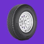 Miichelin Defender LTX M/S tire shown on a purple background
