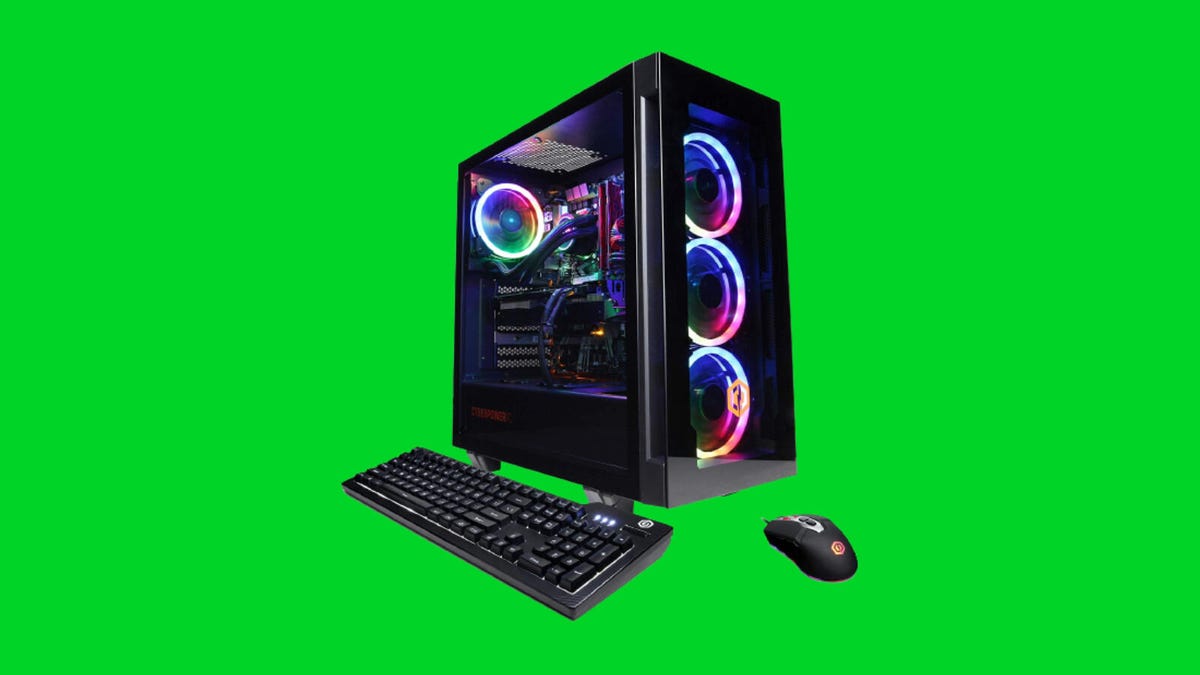 A gaming desktop with internal RGB lighting, keyboard and mouse against a green background.