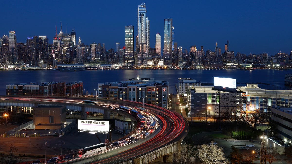 Cars Enter and Exit the Lincoln Tunnel at Sunset in New York City