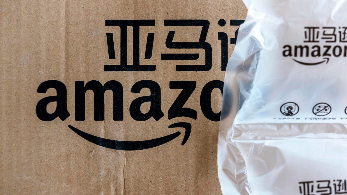 Icon of Amazon.cn on package box, arranged for photograph.