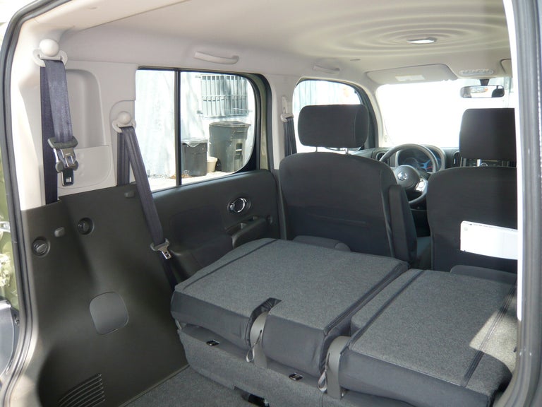 The Cube offers sliding 60/40 fold-flat rear seats and storage in the left C-pillar.