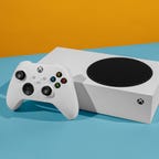 A white Xbox Series S and wireless controller.