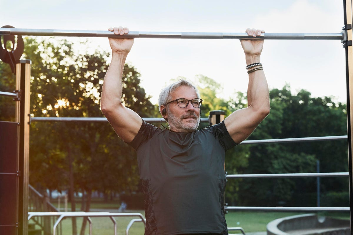 portrait of an active senior man doing exercise in the city of Berlin - stock photo