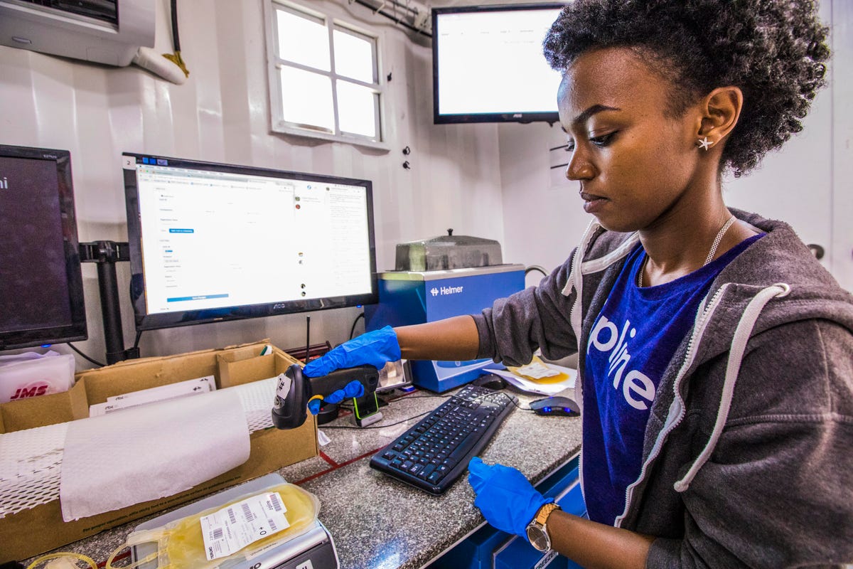 rwanda-Lab technicians prepare blood platelets for flight to rural hospitals via drone.