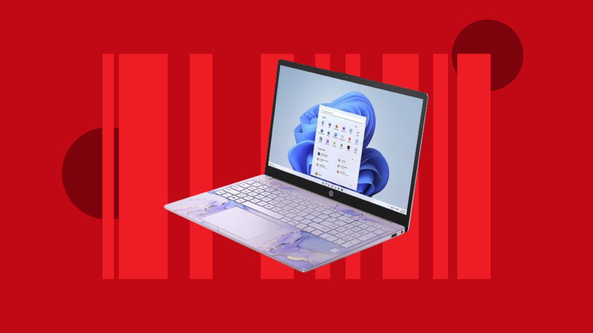 A 15-inch HP laptop is displayed against a red background.