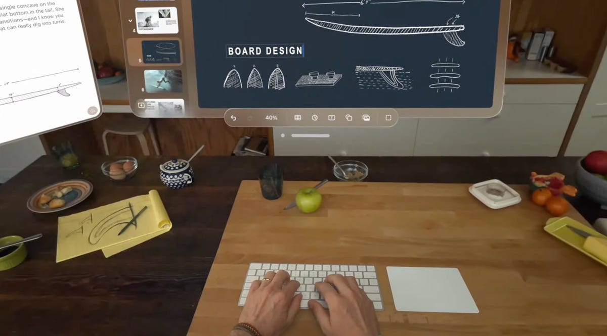 man using keyboard to work using apple vision pro headset