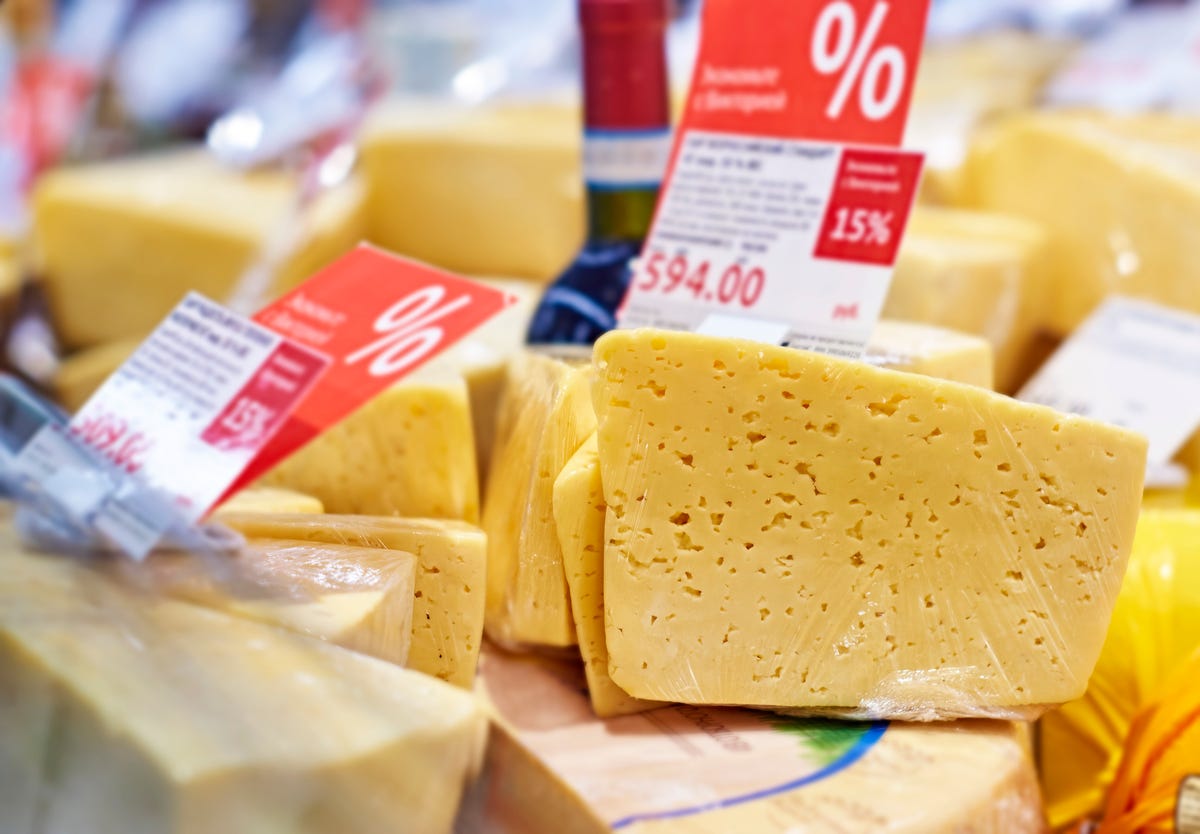 cheese on display with discount tags