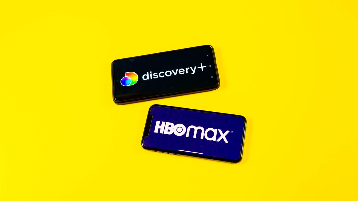 Discovery Plus and HBO Max logos on phones