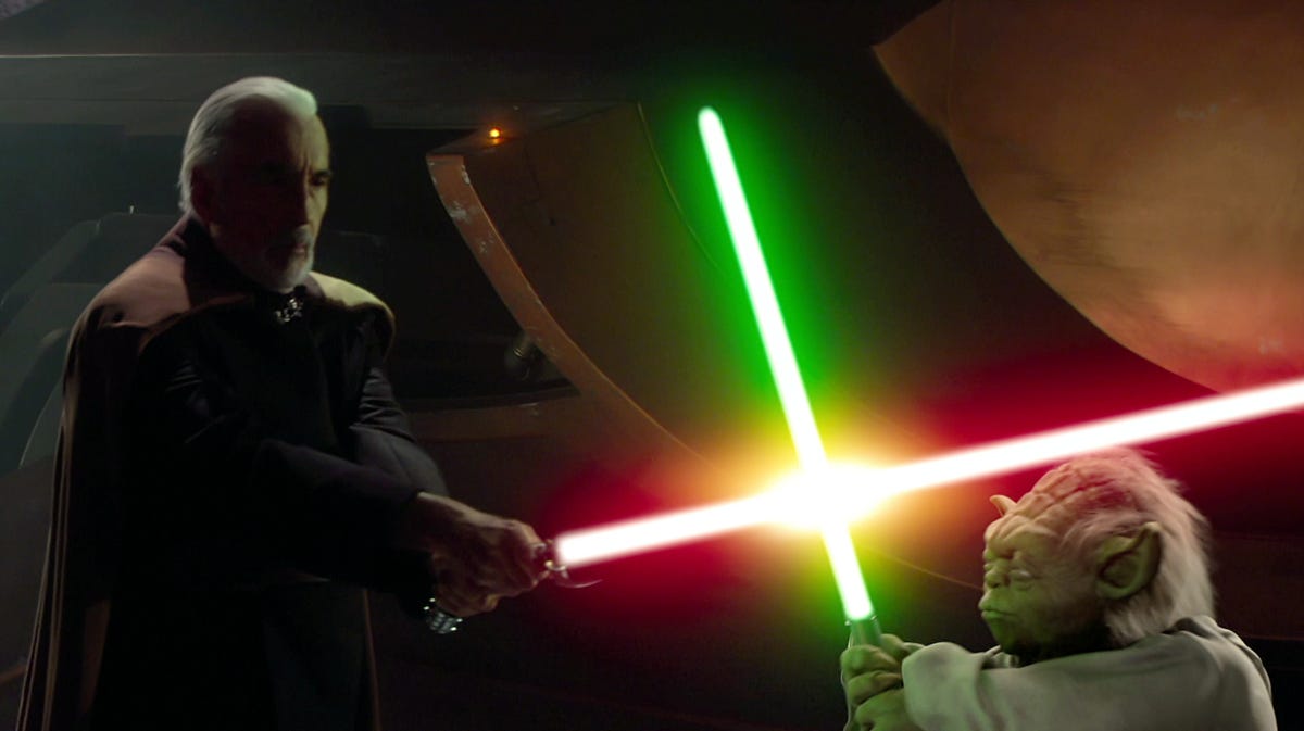 Count Dooku and Yoda cross lightsabers