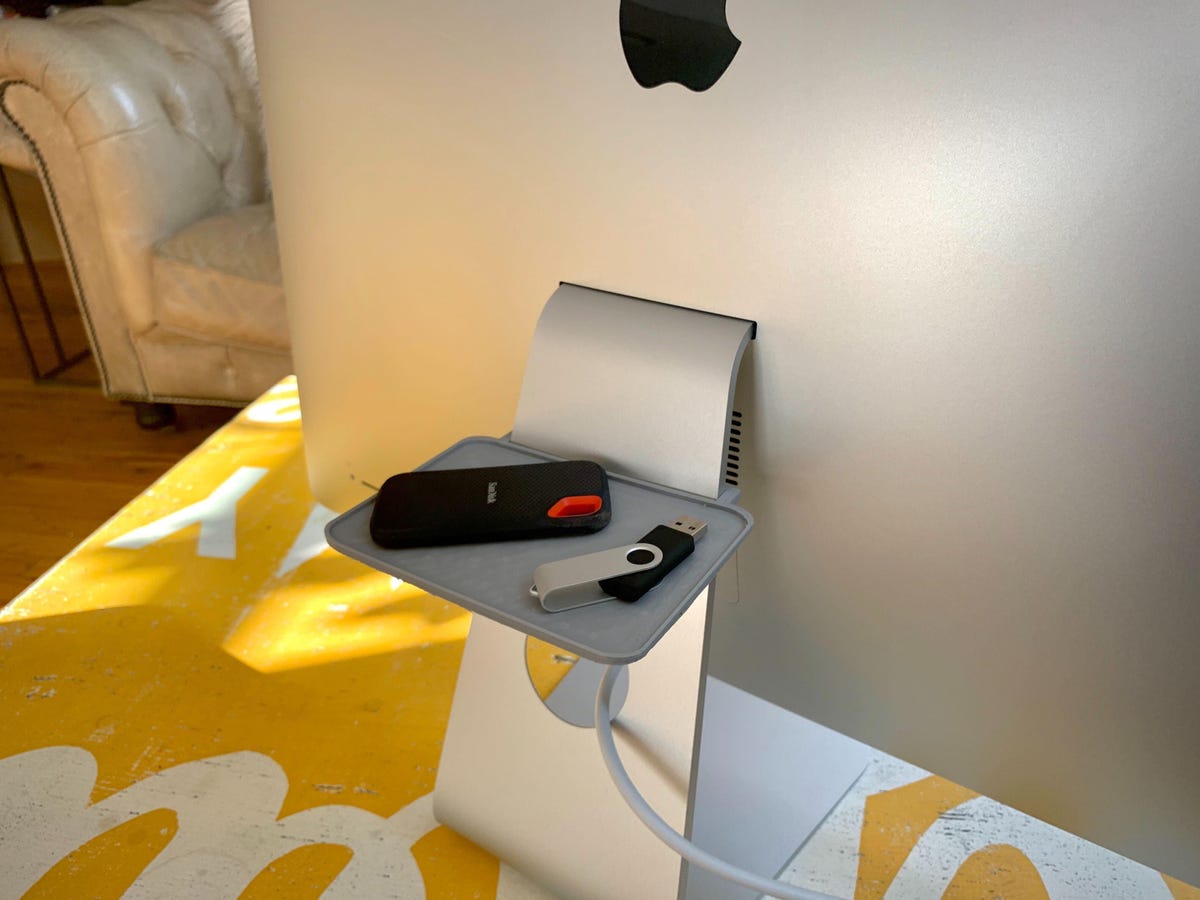 A 3D-printed shelf on an iMac