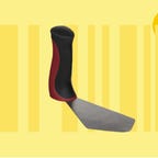 A spatula with a red and black handle with a yellow barcode