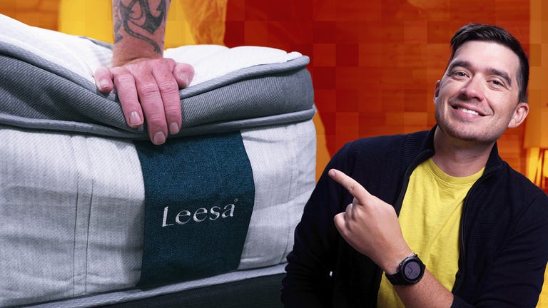 The new Leesa mattress against a colorful background with a man in a black and yellow shirt in the front.