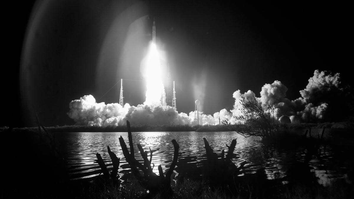 A black and white image of the Artemis I launch.