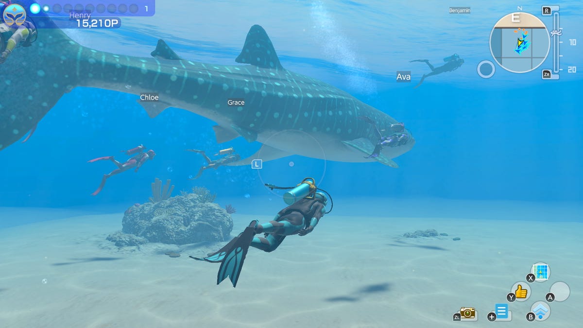 A diver and a huge fish, and other virtual players, in a screenshot from the game Endless Ocean Luminous