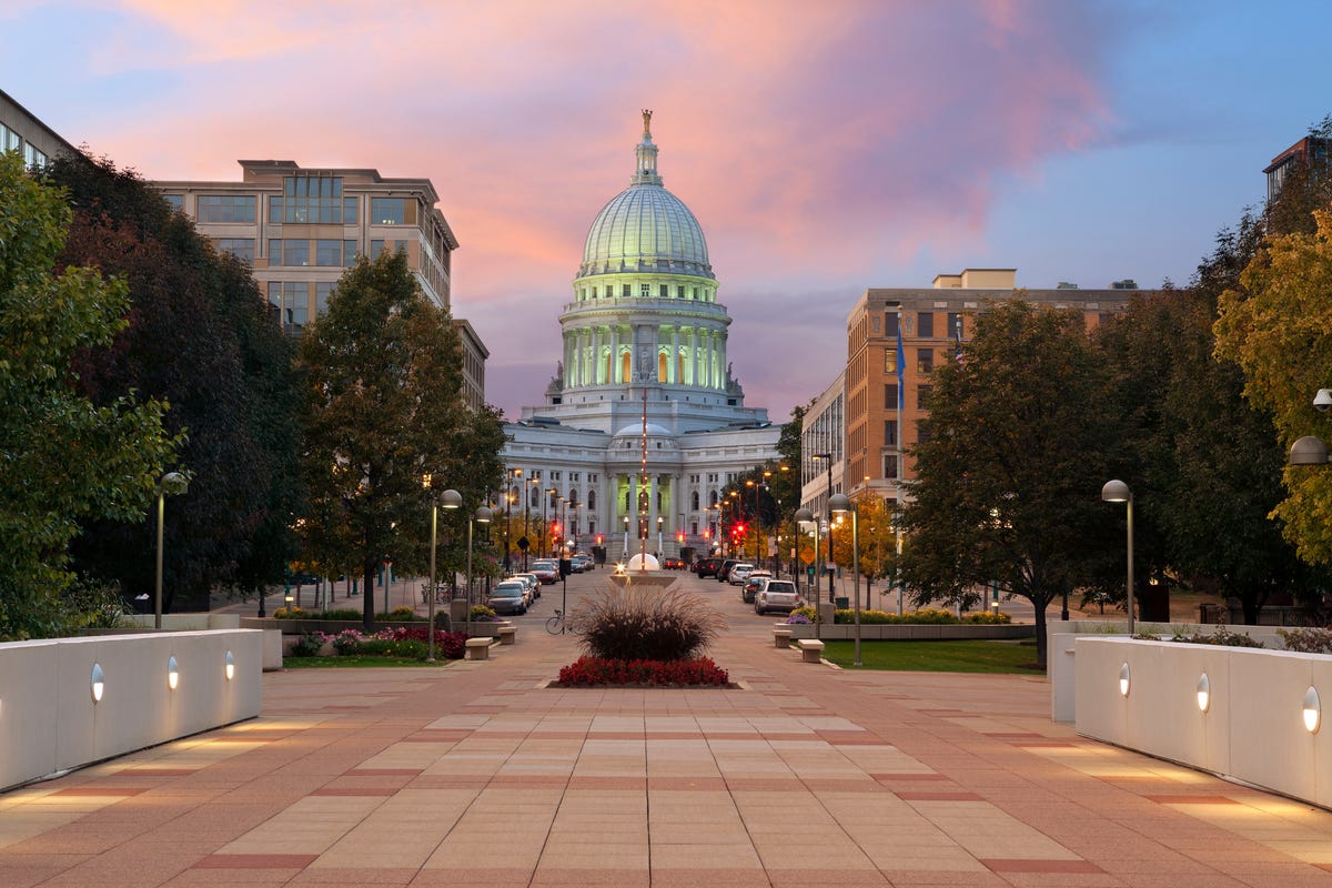 The state capitol building in Madison, Wisconsin at dusk.