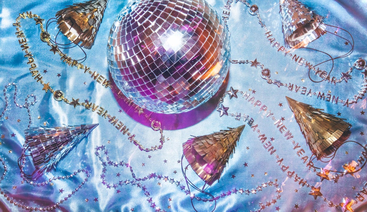 A disco ball and sparkling party hats