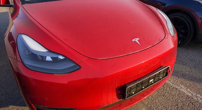 Website indicating Tesla Model 3 is eligible for EV tax credit
